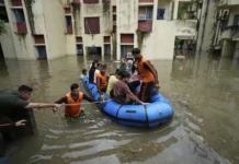 Flood-affected villages in Punjab submerged under water during 2025 monsoon floods – rescue teams helping displaced families.