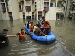 Flood-affected villages in Punjab submerged under water during 2025 monsoon floods – rescue teams helping displaced families.