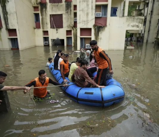 Flood-affected villages in Punjab submerged under water during 2025 monsoon floods – rescue teams helping displaced families.