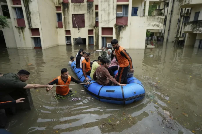 Punjab Flood Crisis 2025: Over 30 Dead, Thousands Displaced Flood-affected villages in Punjab submerged under water during 2025 monsoon floods – rescue teams helping displaced families.