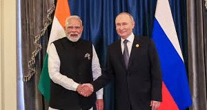 Putin and Modi meeting during the bilateral summit in India, featuring official welcome and delegation talks on key strategic agreements.