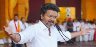 Actor Vijay (Thalapathy) supporters celebrating TVK party's lead in Tamil Nadu Assembly Elections 2026 with posters and sweets in Chennai.